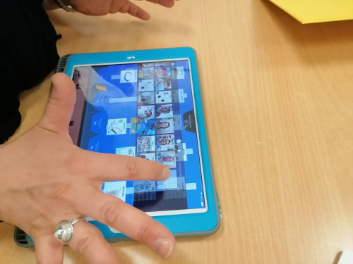photo of an educator using Pyramid PECS on tablet